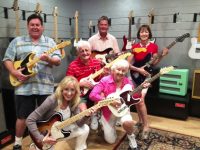 Jammin on the guitar with my dad and family at Fender Factory