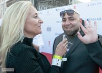 Susan Irby getting ready to interview Duff Goldman on the red carpet at LA Food and Wine 2013