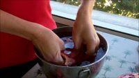 Susan Irby peels a pomegranate