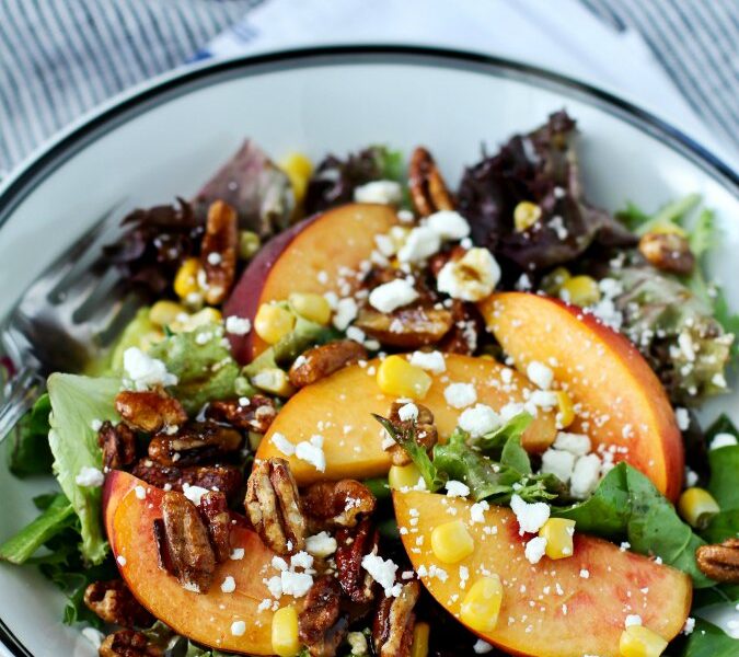 Mixed greens with peaches