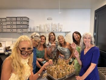 Family and friends assembling Charcuterie Cups