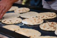 Pupusa on griddle with Karen Castro ANBC